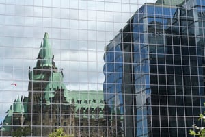 Ottawa Government Parliament building reflection in city buildings